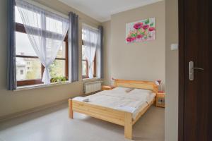 Łóżko lub łóżka w pokoju w obiekcie Dom Turysty PTTK w Bielsku - Białej