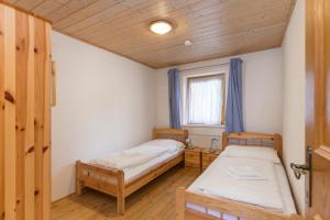 Postel nebo postele na pokoji v ubytování Chalet Struber