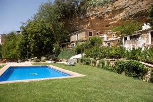 a house with a swimming pool in the yard at El Huertecillo in Arriate