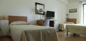 Letto o letti in una camera di Verdeblu Country Hotel