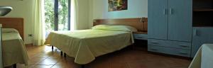 Letto o letti in una camera di Verdeblu Country Hotel