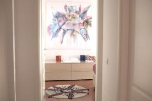 a hallway with a room with a painting on the wall at The Jasmine Terrace Retreat in Bologna