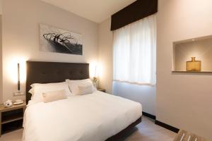 Postel nebo postele na pokoji v ubytování Hotel Mentana, by R Collection Hotels