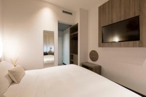 Postel nebo postele na pokoji v ubytování Hotel Mentana, by R Collection Hotels