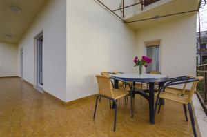 a dining room with a table and chairs at House Marija in Trogir