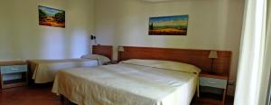 Letto o letti in una camera di Verdeblu Country Hotel