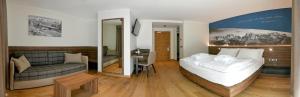 Posteľ alebo postele v izbe v ubytovaní Dolomeet Boutique Hotel