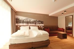 Posteľ alebo postele v izbe v ubytovaní Dolomeet Boutique Hotel