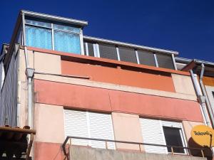 a building with solar panels on the side of it at Cozy Central Apart Porto in Porto