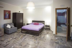 Posteľ alebo postele v izbe v ubytovaní Pompei Gryllus