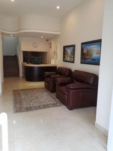 a living room with a couch and a table at Hotel Quinta in Tijuana