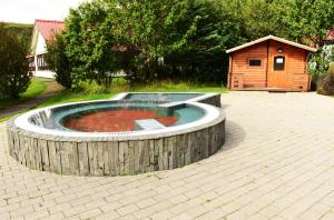 a pool with a fire hydrant in the middle of it at Hotel Katla by Keahotels in Vík