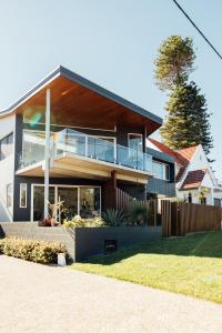 a large house with a balcony on top of it at BULC Boutique Bed & Breakfast in Belmont