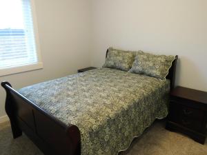 a bedroom with a bed and a window at 3 Bedroom House #37, Sunalta Downtown in Calgary