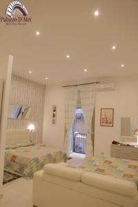 Una cama o camas en una habitación de Palazzo D'Atri