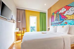 MaxOneHotels at Resort Makassar客房内的一张或多张床位