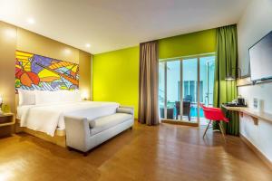 MaxOneHotels at Resort Makassar客房内的一张或多张床位