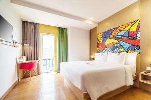 MaxOneHotels at Resort Makassar客房内的一张或多张床位