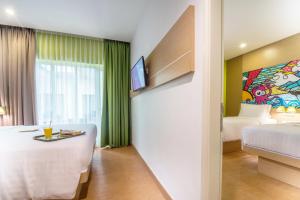 MaxOneHotels at Resort Makassar客房内的一张或多张床位