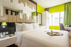 MaxOneHotels at Resort Makassar客房内的一张或多张床位