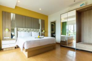 MaxOneHotels at Resort Makassar客房内的一张或多张床位