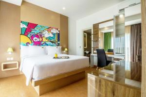 MaxOneHotels at Resort Makassar客房内的一张或多张床位