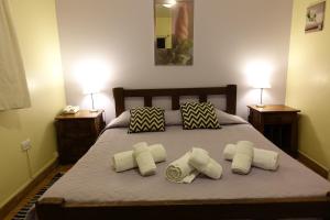 En eller flere senge i et værelse på Hosteria Belvedere