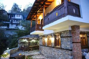 a large house with a balcony on top of it at Yancheva Guest House in Delchevo