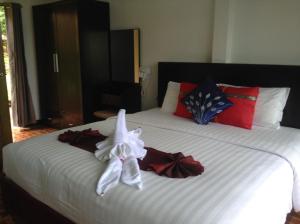 Ein Bett oder Betten in einem Zimmer der Unterkunft Faye Orchid Garden Resort