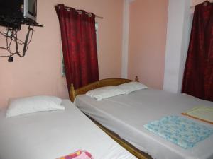 Lova arba lovos apgyvendinimo įstaigoje Hotel Lalaji Bayview