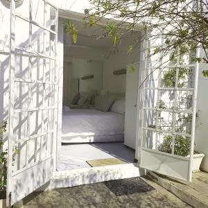 an open door to a bedroom with a bed at Green Park Manor in Johannesburg