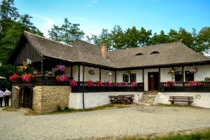 a building with flowers on a balcony at Hanul Vestem in Sibiu