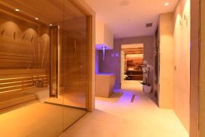 Posteľ alebo postele v izbe v ubytovaní Dolomeet Boutique Hotel