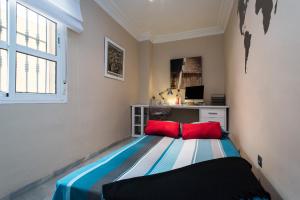 Postel nebo postele na pokoji v ubytování Sevilla Sun