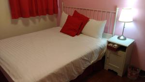 Uma cama ou camas num quarto em Breadtree Homestay