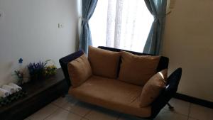 Uma área de estar em Breadtree Homestay