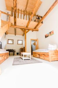 a bedroom with two beds and a staircase at Wilhelmshof Feggendorf in Feggendorf