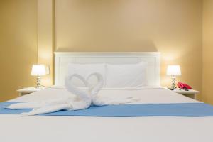 Postel nebo postele na pokoji v ubytování Zing Resort & Spa