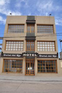 a large building with windows and a hotel at Hotel Portal del Río in La Paz
