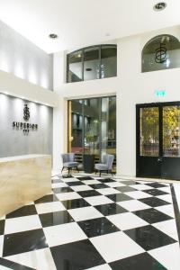 a store lobby with a black and white checkered floor at Superior One Boutique Hotel in Thessaloniki