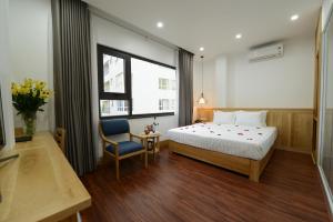 Posteľ alebo postele v izbe v ubytovaní Blue Hanoi Inn City Hotel