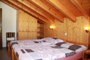 Postel nebo postele na pokoji v ubytování Haus Pan