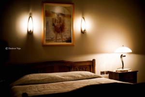 Voodi või voodid majutusasutuse Real Scampis Hotel toas