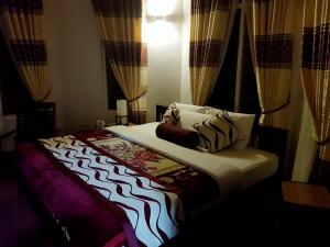 Giường trong phòng chung tại Nuwara Eliya Hills Rest