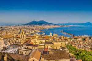 an aerial view of a city and the ocean at Benvenuto a Napoli in Naples