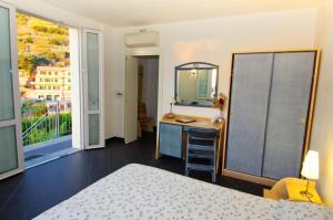 Letto o letti in una camera di Cinqueterre Residence