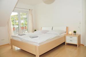 Кровать или кровати в номере Ferienwohnung Bergdomizil