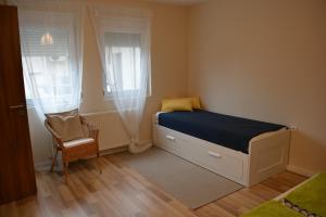 Postel nebo postele na pokoji v ubytování Napsugár Vendégház