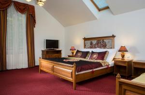 En eller flere senger på et rom på Spa Resort Libverda - Villa Friedland