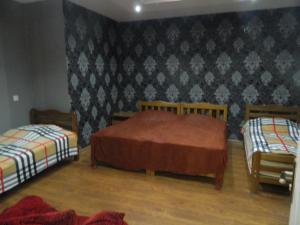 Postel nebo postele na pokoji v ubytování Guest House Nua